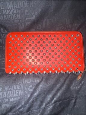 Christian Louboutin spiked red zip long wallet.